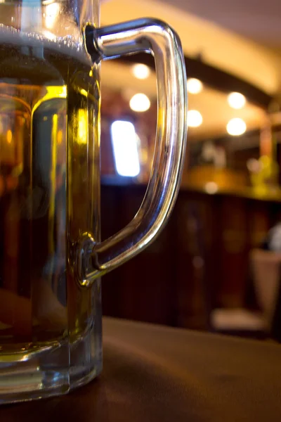 Beer glass in bar — Stock Photo, Image