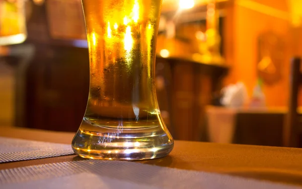 Glass of beer on a table — Stock Photo, Image