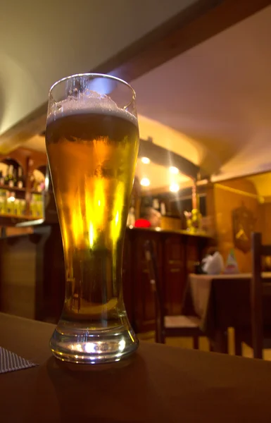 Glass of beer on a table — Stock Photo, Image