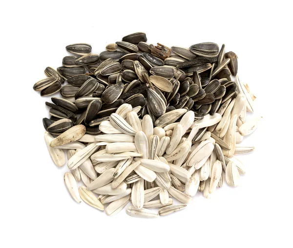 Sunflower seeds on white — Stock Photo, Image