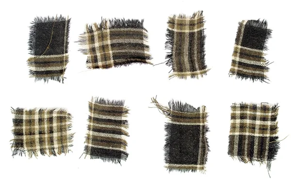Quadrados de tecido com bordas desgastadas — Fotografia de Stock