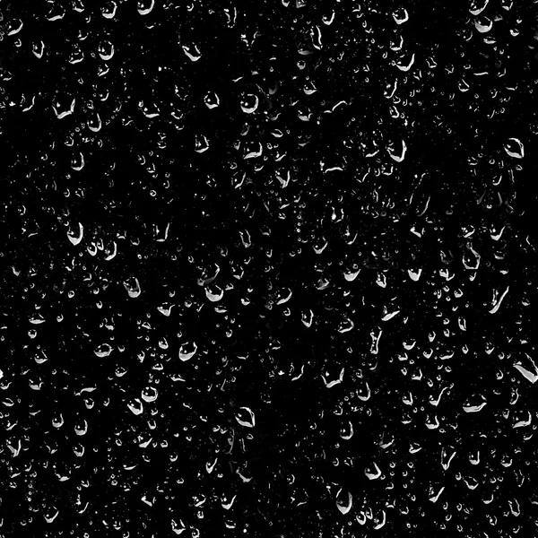 Bolle di gocce d'acqua su un buio — Foto Stock