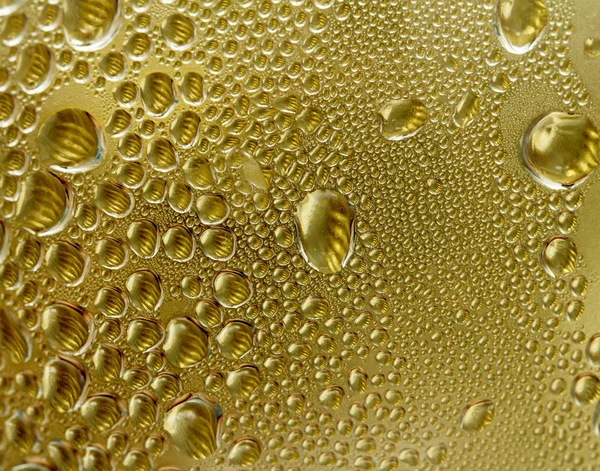 Drops on a golden background — Stock Photo, Image