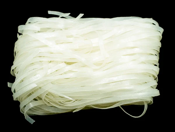 Rice noodles on a black — Stock Photo, Image