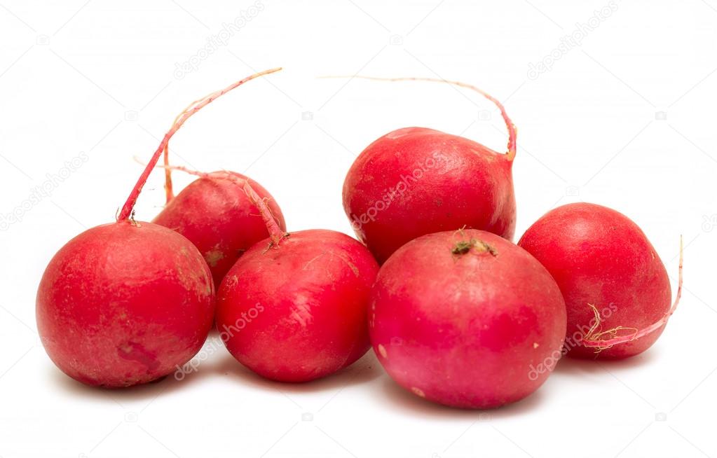 Red radishes on a white