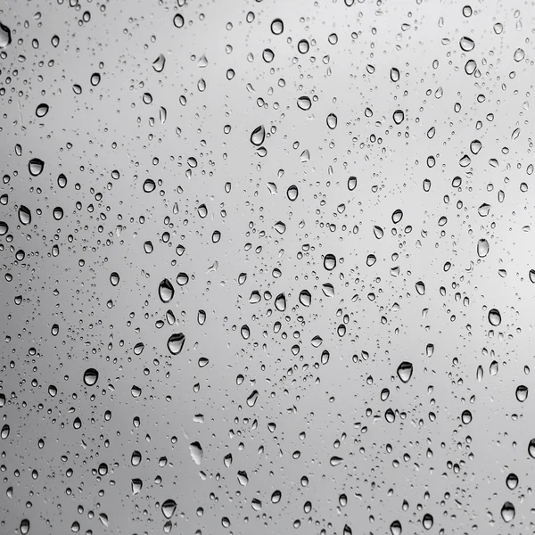 Gotas de lluvia en vidrio de ventana —  Fotos de Stock