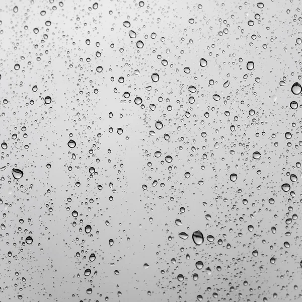 Gocce di pioggia sul vetro della finestra — Foto Stock