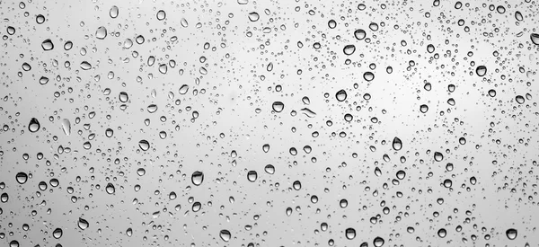 Gotas de lluvia en vidrio de ventana — Foto de Stock