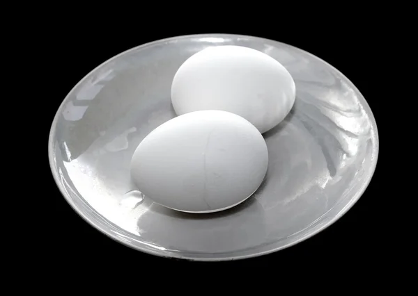 Eggs on a black background — Stock Photo, Image