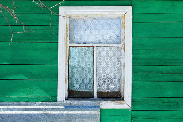 Window in the wall of the house — Stock Photo, Image