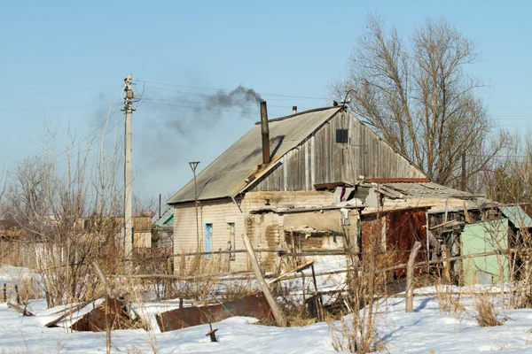 Maison dans le village hiver — Photo