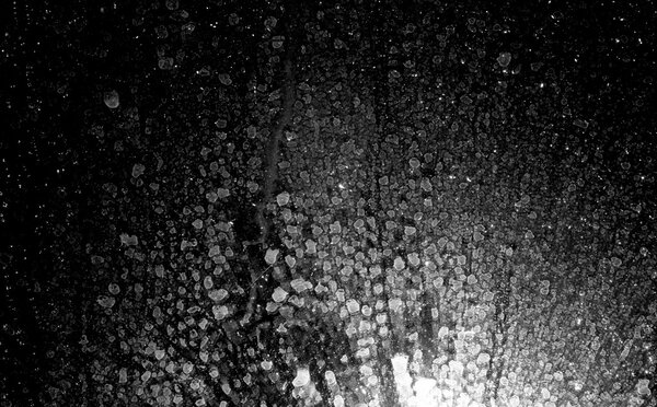 Drops of water on a dark glass