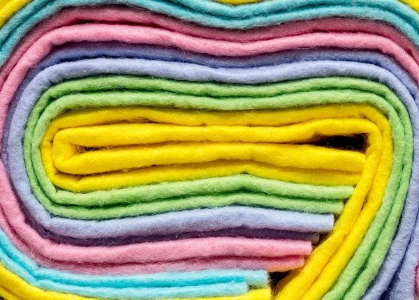 Frottee-Handtücher in verschiedenen Farben Hintergrund — Stockfoto
