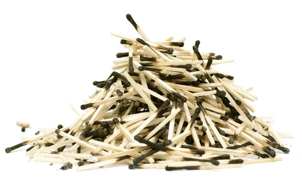 Pile of burnt matches on a white background — Stock Photo, Image