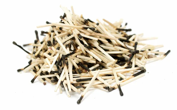 Pile of burnt matches on a white background — Stock Photo, Image