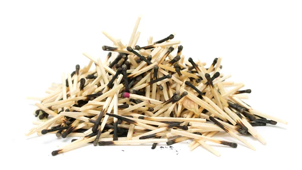 Pile of burnt matches on a white background — Stock Photo, Image