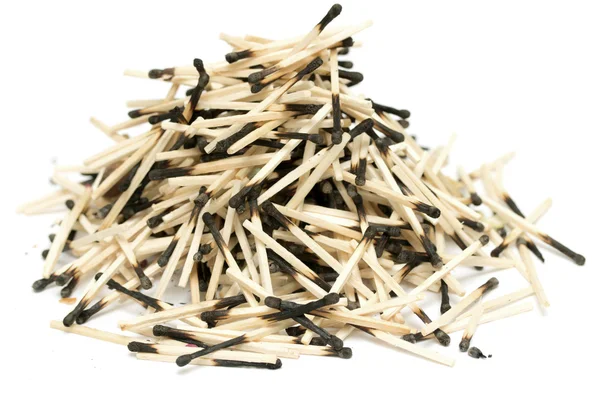 Pile of burnt matches on a white background — Stock Photo, Image
