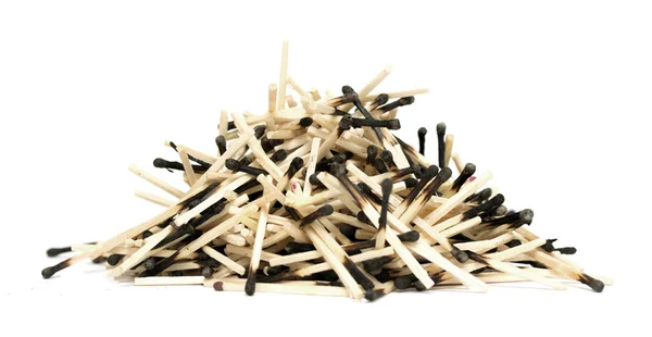 Pile of burnt matches on a white background — Stock Photo, Image