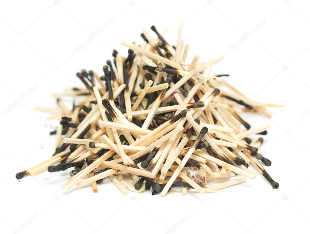 pile of burnt matches on a white background