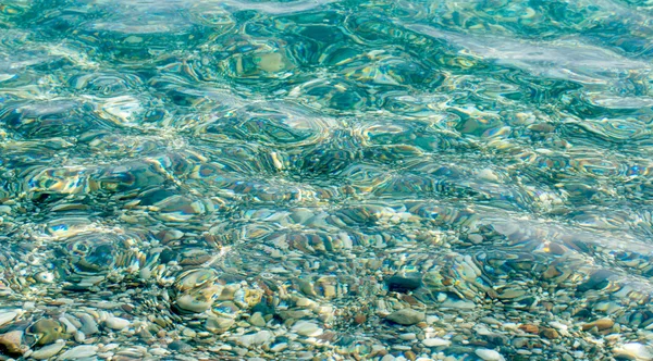 Pebbles with sea waves — Stock Photo, Image