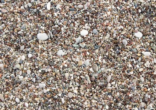 พื้นหลังของก้อนหินบนชายหาด — ภาพถ่ายสต็อก