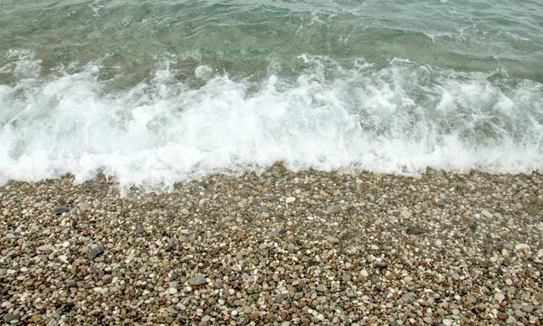 Wave foam on the beach. — Stock Photo, Image