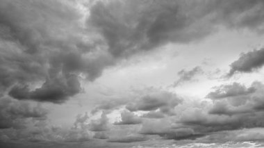 Clouds against the sky, black and white.