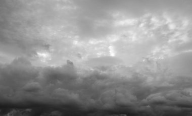 Clouds against the sky, black and white.