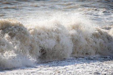 Seashore, small stones, sea wave. Marine background.