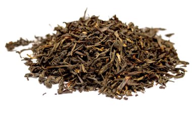 A pile of tea leaves on a white background. The leaves are brown and appear to be dried