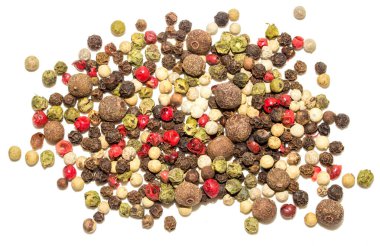 A pile of different colored peppers and spices. The spices are mixed together and are not in any particular order