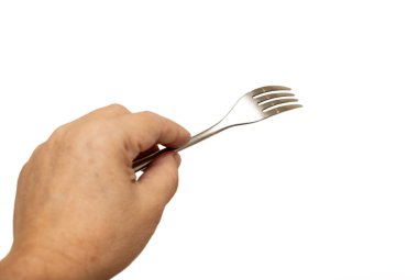 Bir el çatalı tutuyor ve dişleri yukarı bakıyor. Merak ve keşif kavramı