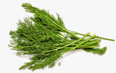 A bunch of green herbs with a white background. The herbs are fresh and healthy looking. Concept of freshness and vitality