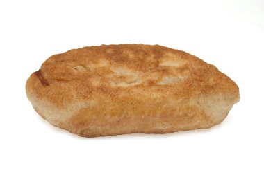 Kahverengi kabuklu bir parça ekmek. Bu bir parça ekmeğin yakın çekimi.