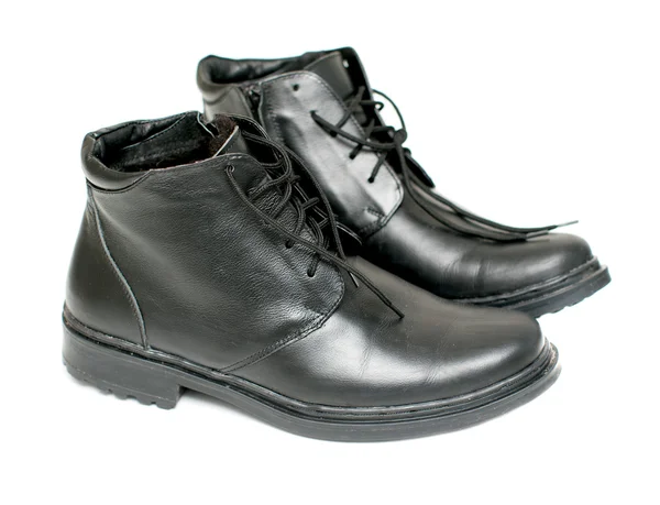 Bottes en cuir noir pour hommes sur fond blanc — Photo