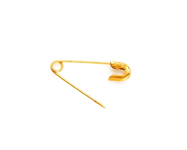 Gold pin on a white background — Stock Photo, Image