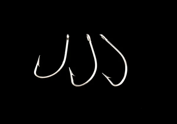 Steel fishing hooks on a black background — Stock Photo, Image