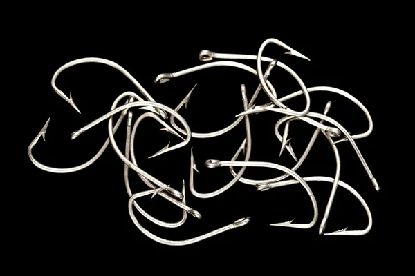 Steel fishing hooks on a black background — Stock Photo, Image