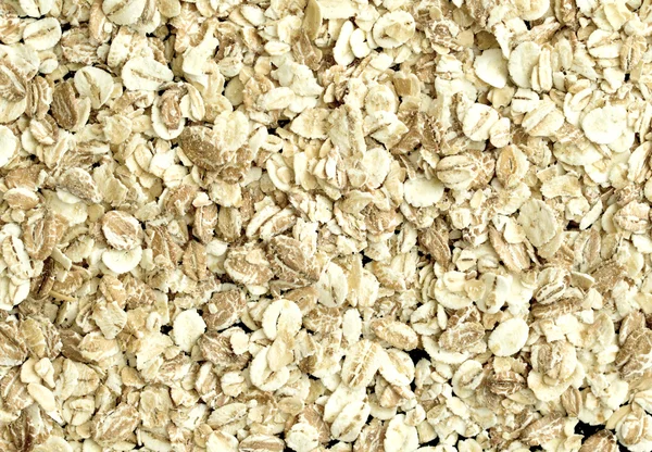 Oat flakes, oatmeal porridge — Stock Photo, Image