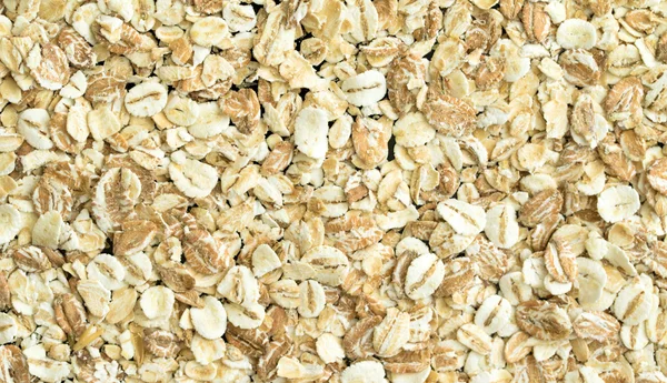 Oat flakes, oatmeal porridge — Stock Photo, Image