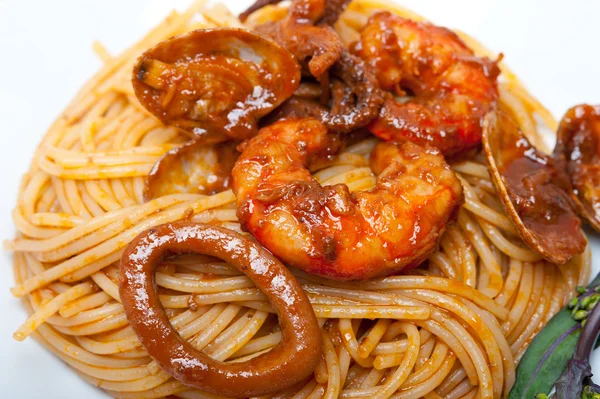 Italian seafood spaghetti pasta on red tomato sauce — Stock Photo, Image