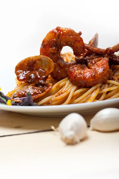 Italian seafood spaghetti pasta on red tomato sauce — Stock Photo, Image