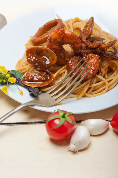 Italian seafood spaghetti pasta on red tomato sauce — Stock Photo, Image