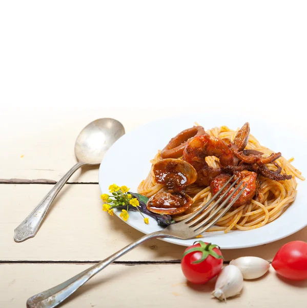 Italian seafood spaghetti pasta on red tomato sauce — Stock Photo, Image