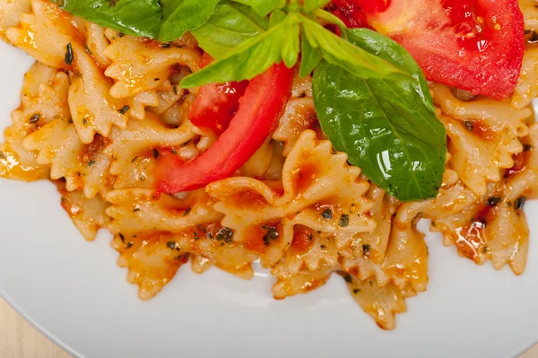 Italian pasta farfalle butterfly bow-tie and tomato sauce — Stock Photo, Image