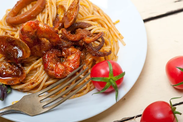 Italian seafood spaghetti pasta on red tomato sauce — Stock Photo, Image