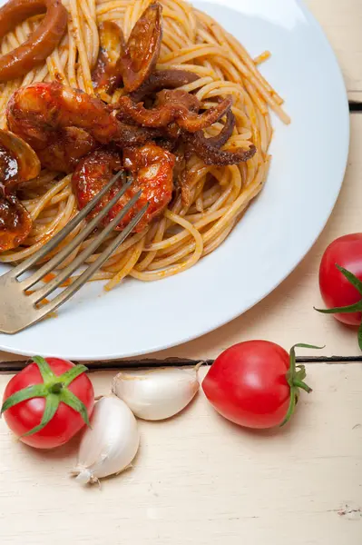 Italian seafood spaghetti pasta on red tomato sauce — Stock Photo, Image