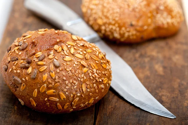 Organic bread over rustic table — Stock Photo, Image