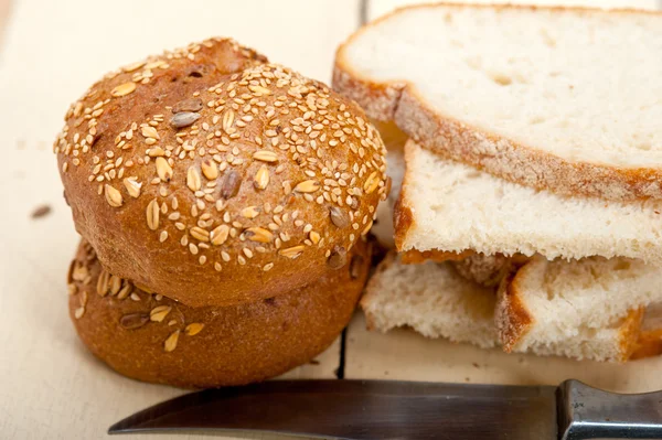 Organic bread over rustic table — Stock Photo, Image