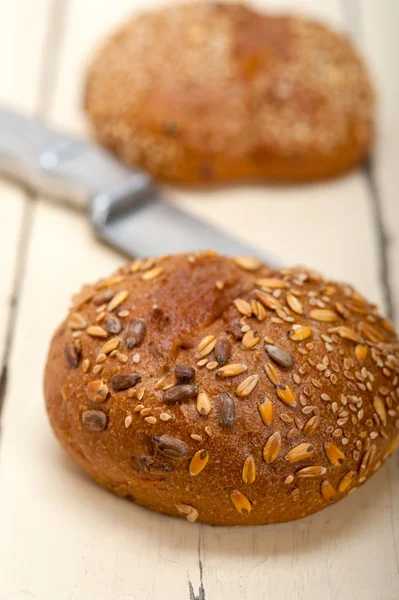 Organic bread over rustic table — Stock Photo, Image